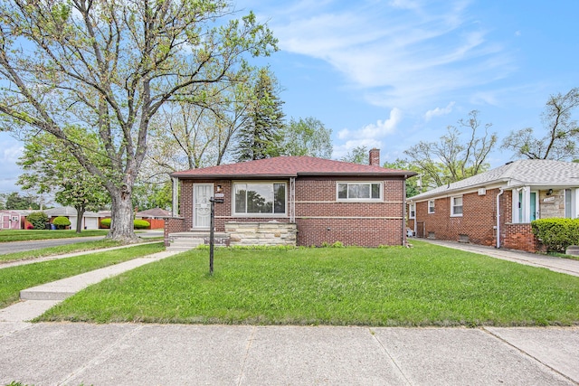 20110 Westbrook St, Detroit, MI 48219 - view of front facade featuring a chimney, a front lawn, and brick siding