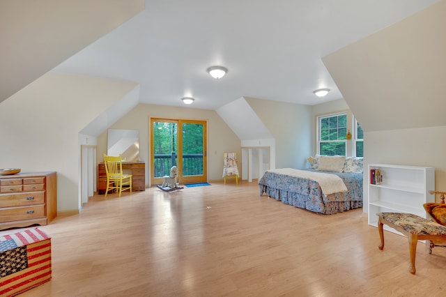 3118 Pratt Ln, Attica, MI 48412 - bedroom with light wood-type flooring, lofted ceiling, multiple windows, and access to outside