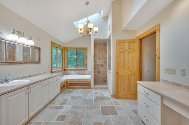 3118 Pratt Ln, Attica, MI 48412 - bathroom featuring stone tile floors, lofted ceiling, a chandelier, a tile shower, and a garden tub