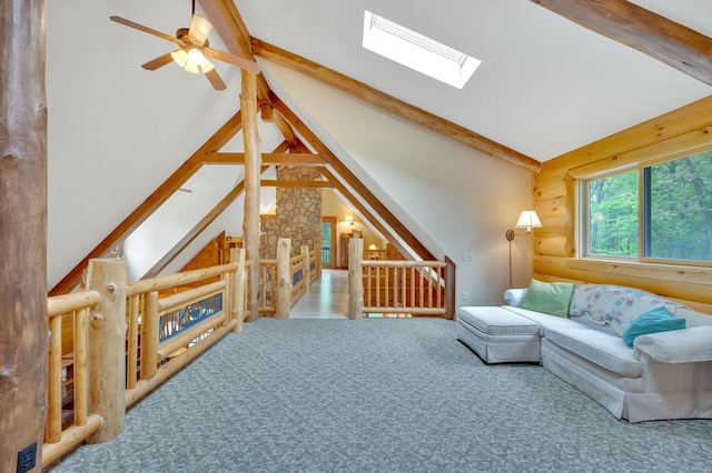 3118 Pratt Ln, Attica, MI 48412 - living area with a ceiling fan, a skylight, rustic walls, and carpet flooring