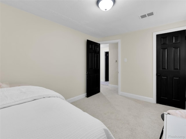 17524 Woodingham Dr, Detroit, MI 48221 - bedroom featuring light carpet and baseboards