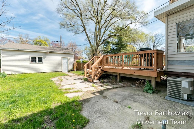 2200 Morton Ave, Muskegon, MI 49441 - view of yard featuring a wooden deck, central AC unit, an outdoor structure, and a patio area