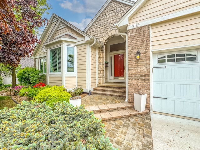 3123 Fairgrove Ter, Rochester Hills, MI 48309 - doorway to property featuring a garage and stone siding