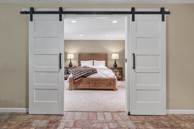 3123 Fairgrove Ter, Rochester Hills, MI 48309 - bedroom with a barn door, baseboards, crown molding, and recessed lighting