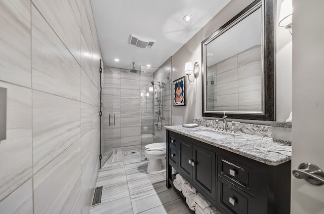3123 Fairgrove Ter, Rochester Hills, MI 48309 - bathroom featuring a stall shower, toilet, vanity, and recessed lighting