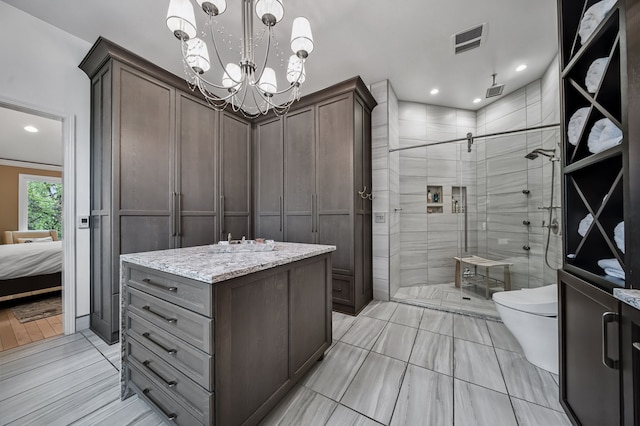 3123 Fairgrove Ter, Rochester Hills, MI 48309 - ensuite bathroom featuring a shower stall, toilet, a chandelier, tile patterned floors, and recessed lighting