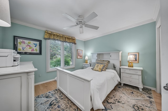 3123 Fairgrove Ter, Rochester Hills, MI 48309 - bedroom with crown molding, light wood finished floors, baseboards, and ceiling fan