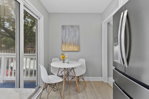 dining space featuring wood finished floors and baseboards