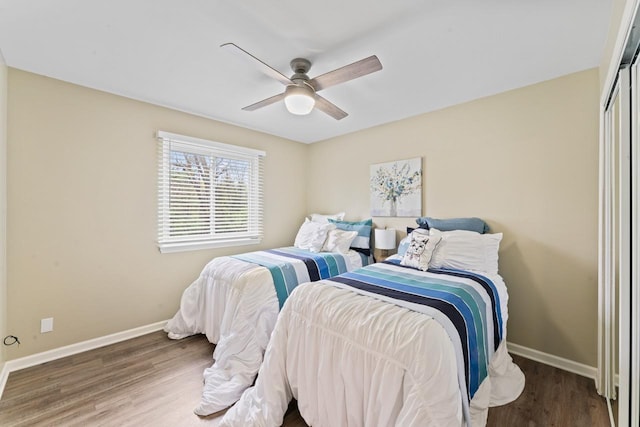 12147 Torrey Rd, Fenton, MI 48430 - bedroom with baseboards, wood finished floors, and ceiling fan