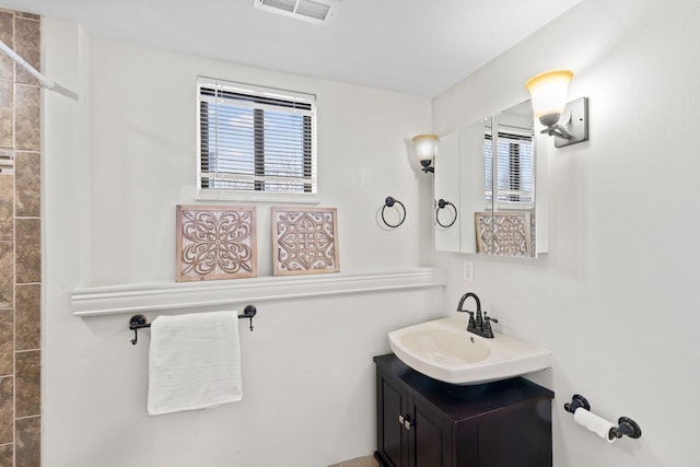 12147 Torrey Rd, Fenton, MI 48430 - full bath featuring healthy amount of natural light, vanity, and a shower