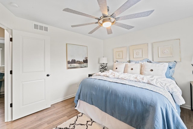 12147 Torrey Rd, Fenton, MI 48430 - bedroom with wood finished floors, baseboards, and ceiling fan