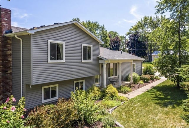 12147 Torrey Rd, Fenton, MI 48430 - rear view of house featuring a yard and a chimney
