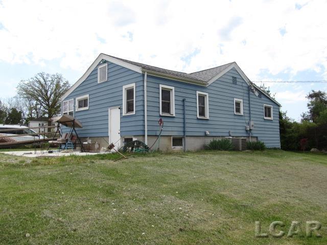 10320 Springville Hwy, Onsted, MI 49265 - view of property exterior with a yard