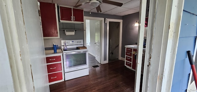 10320 Springville Hwy, Onsted, MI 49265 - kitchen with electric stove, ceiling fan, dark wood-type flooring, light countertops, and a paneled ceiling