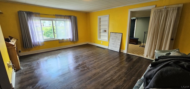 10320 Springville Hwy, Onsted, MI 49265 - unfurnished bedroom featuring ornamental molding, dark wood-style flooring, and baseboards