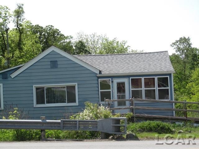 10320 Springville Hwy, Onsted, MI 49265 - view of front of home with a shingled roof