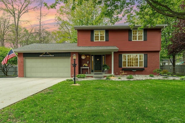 1140 Curwood Rd, Saginaw, MI 48609 - view of front facade with an attached garage, concrete driveway, and brick siding