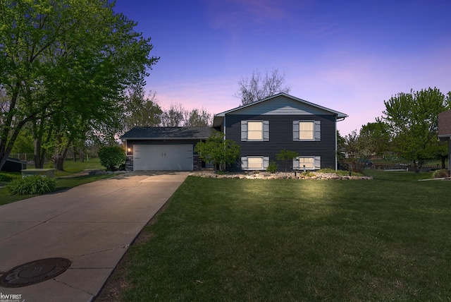 14043 Landings Way, Fenton, MI 48430 - tri-level home with concrete driveway, a front lawn, and an attached garage