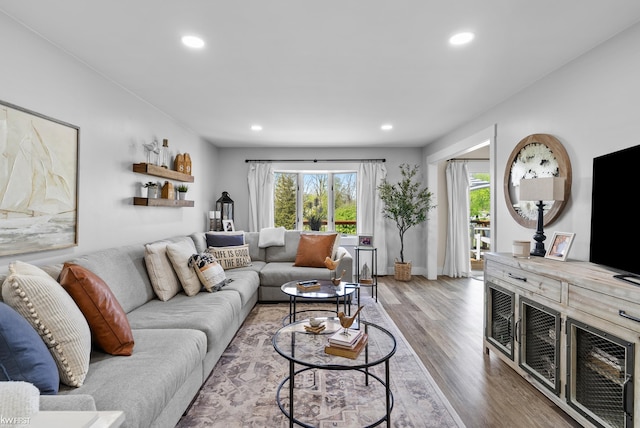 14043 Landings Way, Fenton, MI 48430 - living area featuring plenty of natural light, recessed lighting, wood finished floors, and baseboards