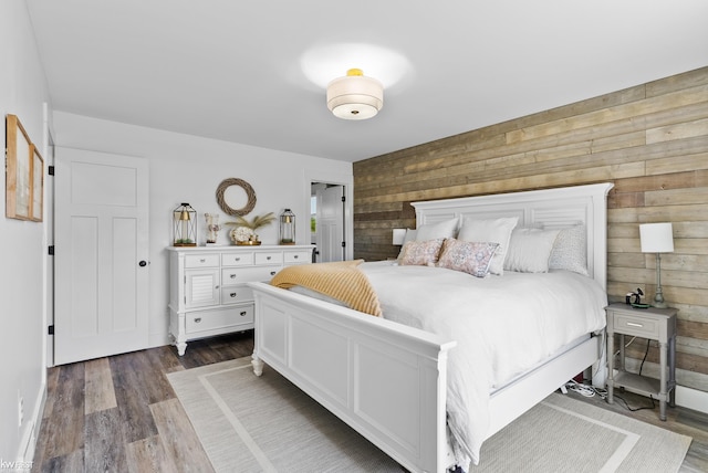 14043 Landings Way, Fenton, MI 48430 - bedroom with wood walls and dark wood-style flooring