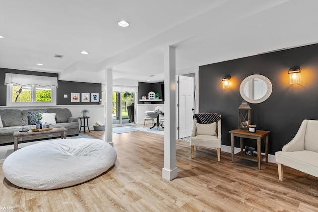 14043 Landings Way, Fenton, MI 48430 - living area with light wood-style floors, healthy amount of natural light, recessed lighting, and baseboards