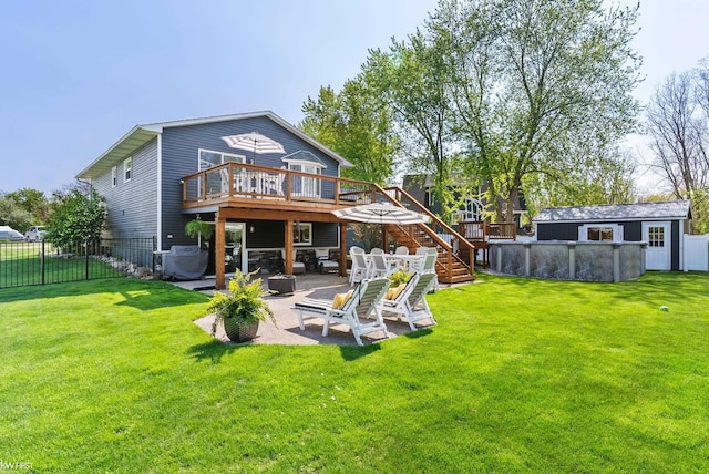 14043 Landings Way, Fenton, MI 48430 - back of property with a wooden deck, stairway, a patio, and an outdoor structure
