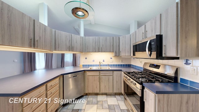 5489 Winchester Way, Gladwin, MI 48624 - kitchen featuring appliances with stainless steel finishes, lofted ceiling, a sink, light brown cabinets, and backsplash