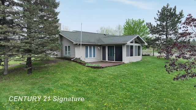 5489 Winchester Way, Gladwin, MI 48624 - rear view of property featuring a chimney, a lawn, and roof with shingles