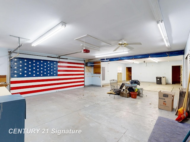 5489 Winchester Way, Gladwin, MI 48624 - garage with a ceiling fan and a garage door opener