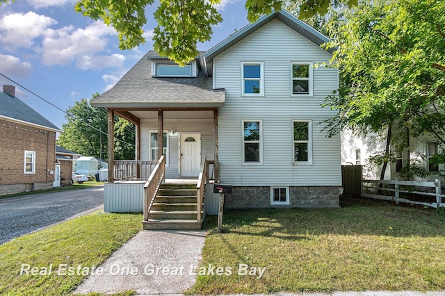 1006 Cass Ave, Bay City, MI 48708 - traditional-style house featuring covered porch and a shingled roof