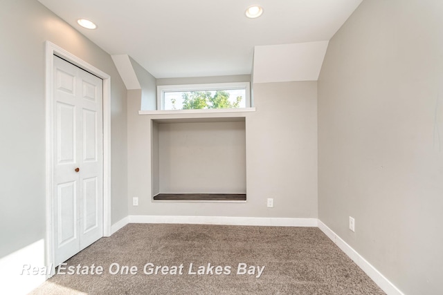 1006 Cass Ave, Bay City, MI 48708 - unfurnished bedroom featuring carpet, a closet, baseboards, and recessed lighting