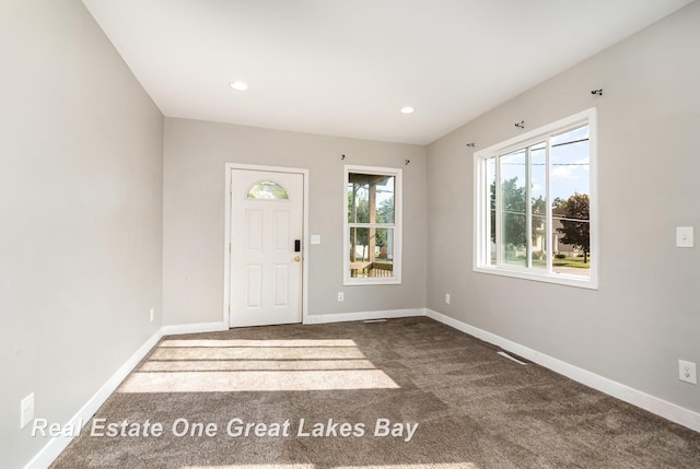 1006 Cass Ave, Bay City, MI 48708 - carpeted foyer entrance featuring plenty of natural light, baseboards, and recessed lighting