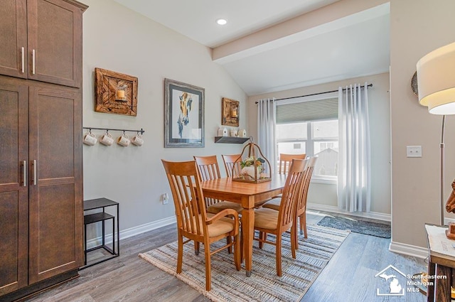8265 Grande Lake Cir, Temperance, MI 48182 - dining space featuring lofted ceiling, light wood-style flooring, baseboards, and recessed lighting