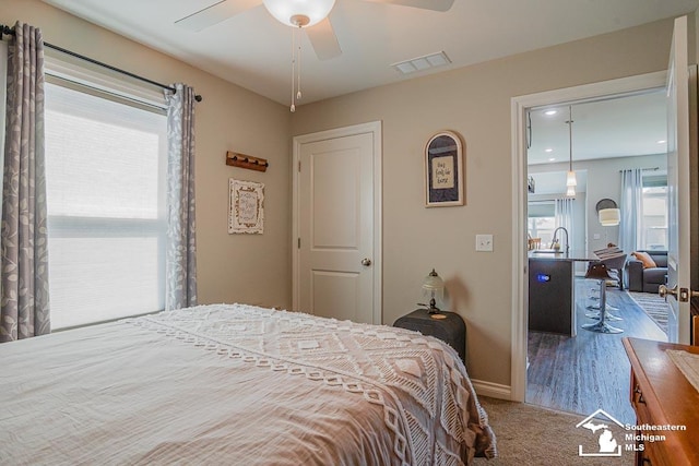 8265 Grande Lake Cir, Temperance, MI 48182 - bedroom featuring baseboards, carpet, and a ceiling fan
