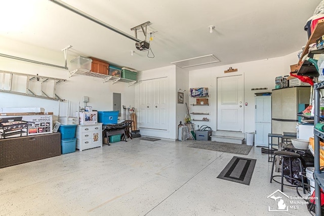 8265 Grande Lake Cir, Temperance, MI 48182 - garage with a garage door opener and electric panel