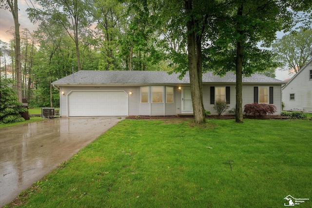 2285 Reddington Dr, Temperance, MI 48182 - single story home with a garage, driveway, central AC, and a front lawn