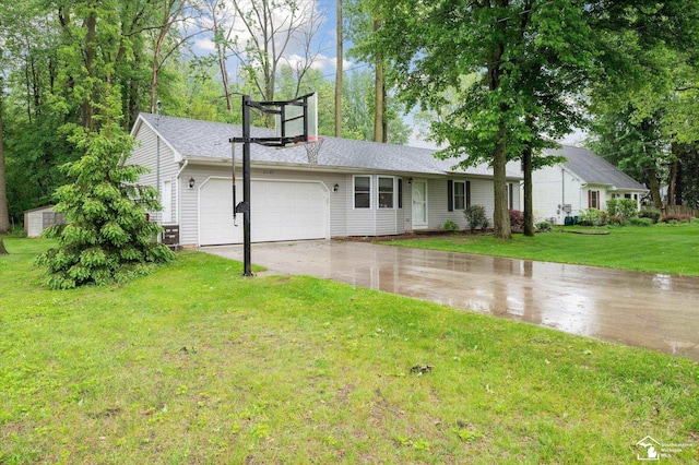 2285 Reddington Dr, Temperance, MI 48182 - single story home with asphalt driveway, a garage, and a front yard
