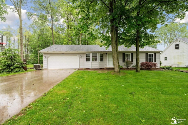 2285 Reddington Dr, Temperance, MI 48182 - ranch-style house with an attached garage, driveway, central air condition unit, a front yard, and roof with shingles
