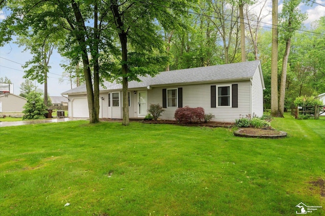 2285 Reddington Dr, Temperance, MI 48182 - single story home featuring an attached garage, driveway, a front lawn, and roof with shingles