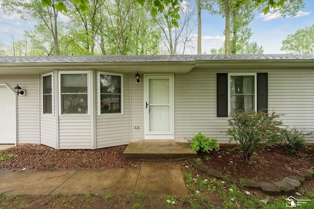 2285 Reddington Dr, Temperance, MI 48182 - view of front facade featuring an attached garage and roof with shingles