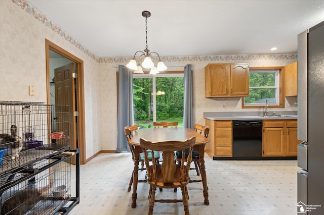 2285 Reddington Dr, Temperance, MI 48182 - dining room with a chandelier, wallpapered walls, light flooring, and baseboards