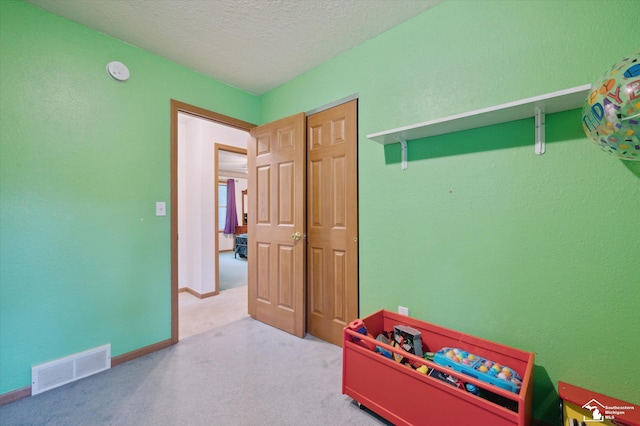2285 Reddington Dr, Temperance, MI 48182 - playroom featuring carpet, a textured ceiling, and baseboards