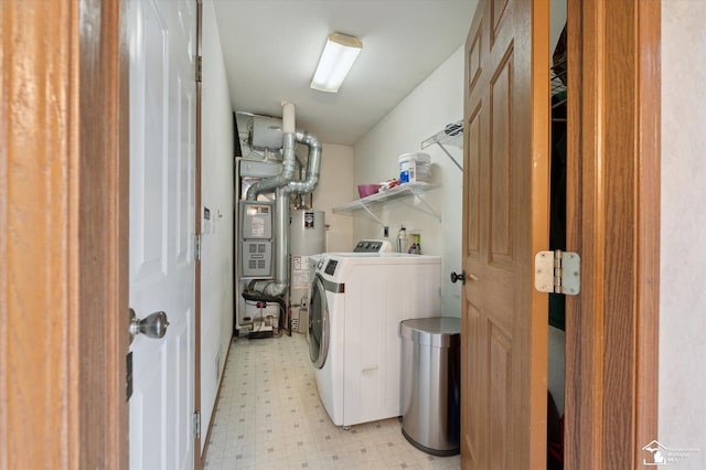2285 Reddington Dr, Temperance, MI 48182 - laundry area with washer / dryer, light flooring, and gas water heater