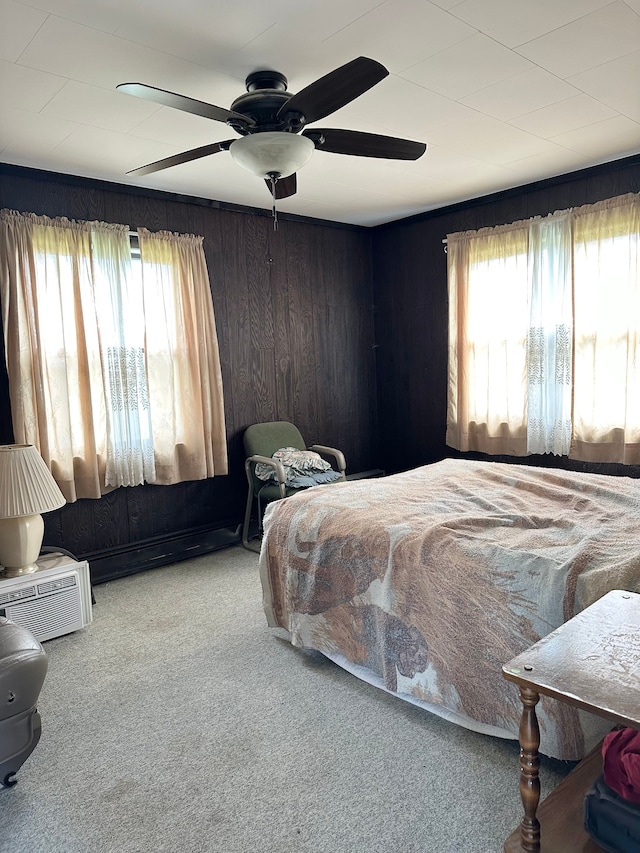 9548 Sharp Rd, Clifford, MI 48727 - carpeted bedroom with multiple windows, ceiling fan, and wooden walls