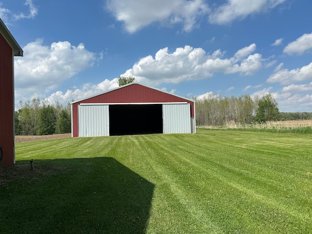 9548 Sharp Rd, Clifford, MI 48727 - view of pole building featuring a lawn