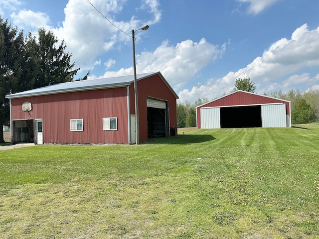 9548 Sharp Rd, Clifford, MI 48727 - view of pole building featuring a lawn