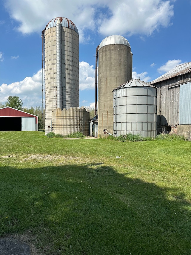 9548 Sharp Rd, Clifford, MI 48727 - view of pole building featuring a lawn