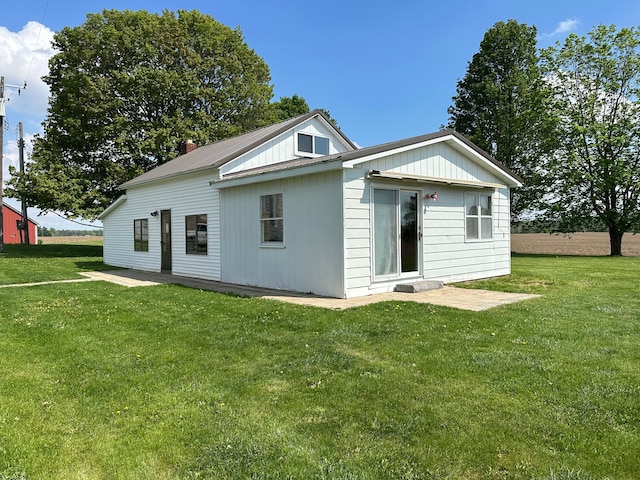 9548 Sharp Rd, Clifford, MI 48727 - back of property with a lawn and metal roof