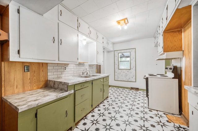 237 Main St, Walkerville, MI 49459 - kitchen with a sink, light flooring, green cabinets, light countertops, and range with electric cooktop