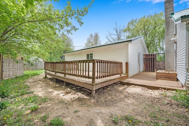 237 Main St, Walkerville, MI 49459 - rear view of house with fence and a deck